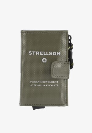 Olive green wallet with a textured finish, featuring white branding and coordinates, secured with a snap closure and a wrist strap.