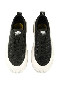 Black sneakers with textured fabric upper, white rubber sole, and round toe. Features black laces and a woven pull tab on the back.