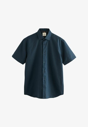 Trumpomis rankovėmis marškiniai tamsiai žaliai mėlynos spalvos, pagaminti iš tekstūruotos medžiagos, su standartiniu apykakliu ir šešiais priekiniais mygtukais, tiesia apačia.