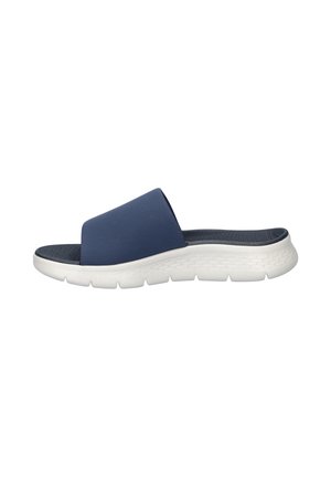 Navy blue slide sandal with wide fabric strap, cushioned textured insole, and thick white rubber sole designed for comfort.