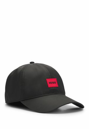 Black cap made of smooth fabric with a curved visor. Features a red rectangular logo patch labeled "HUGO" on the front.