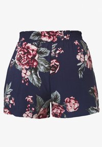 Tummansiniset shortsit, joissa on joustava vyötärö, ja joissa on suuri vaaleanpunainen ja punainen kukkakuvio vihreillä lehdillä.