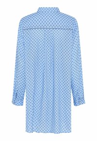 Camicia a maniche lunghe di color blu chiaro con un motivo floreale. Realizzata in tessuto morbido, con polsini abbottonati e dettaglio sul retro.