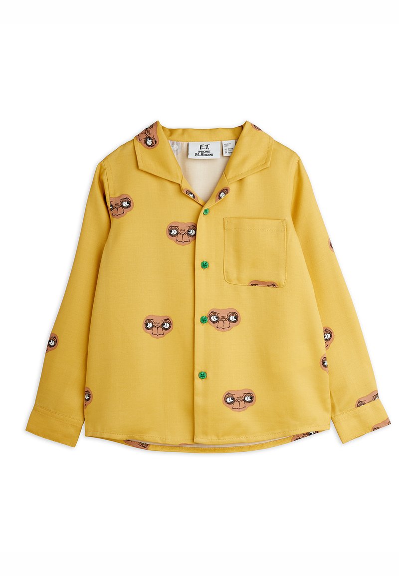 Κίτρινο μακρυμάνικο πουκάμισο με εκτύπωση του χαρακτήρα "E.T.", με κολάρο τύπου notch, πράσινα κουμπιά και τσέπη στο στήθος. Μαλακή υφή υφάσματος.