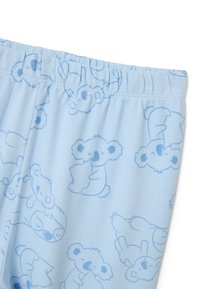 Tela de color azul claro con un patrón de koalas y perezosos de caricatura. Cintura elástica, textura suave, diseños juguetones que presentan varias posiciones.