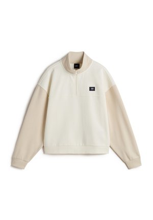 Pullover mit kurzem Reißverschluss in Creme und Beige, mit langen Ärmeln, gerippten Bündchen und einem Markenstoffpatch auf der Brust. Weiches, strukturiertes Material.