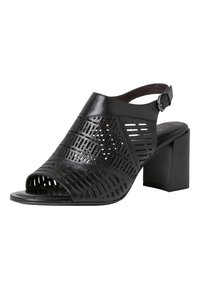 Sandale à talons en cuir noir avec un bout ouvert, présentant un design perforé et une sangle de cheville ajustable. Talon carré pour un soutien stable.