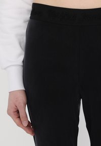 Versace Jeans Couture Leggings - Trousers - black
