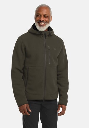 Donkergroene hoodie met ribbeltextuur en ritszakken. Voorzien van een rits aan de voorkant en een verstelbare capuchon met trekkoord.