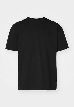 Black cotton t-shirt, crew neck, short sleeves, featuring a subtle, tonal logo on the chest and a straight hem.