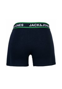 Boxers bleu marine avec une ceinture élastique de marque verte et blanche, présentant un design ajusté et une texture lisse.