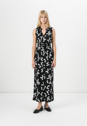 Black sleeveless dress with a floral white pattern, featuring a v-neckline and cinched waist, flowing to a midi length.