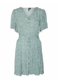 Robe verte à manches courtes avec des pois blancs, décolleté en V, fermeture à bouton, taille à nouer et jupe évasée. Tissu léger avec une texture douce.