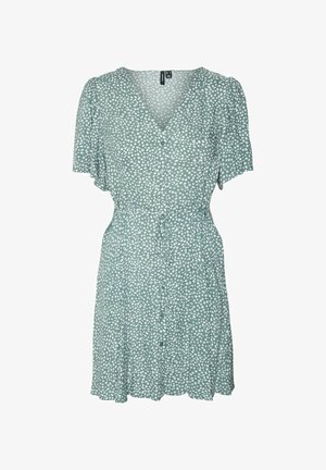 Green short-sleeve dress with white polka dots, v-neckline, button closure, tie waist, and flared skirt. Lightweight fabric with soft texture.