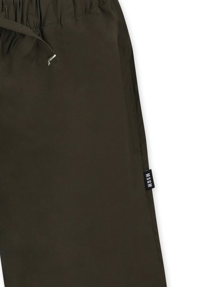 Pantaloni verde oliva in tessuto leggero, dotati di vita elasticizzata con cordoncino e di un'etichetta laterale con la scritta "MSGM."