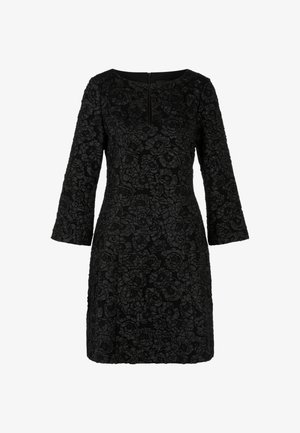 Schwarzes Kleid mit langen Ärmeln, strukturiertem Blumenmuster, rundem Ausschnitt und Reißverschluss hinten. Feminine Silhouette mit knielangem Abschluss.