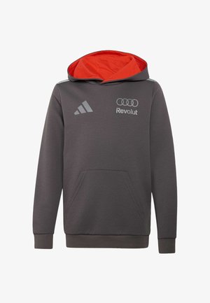 Tummanharmaa hupullinen collegepaita, jossa punainen hupun sisäosa, etutasku, Adidas-logo vasemmassa rinnassa ja Revolut-logon sekä Audin rengaslogon yhdistelmä oikeassa rinnassa.