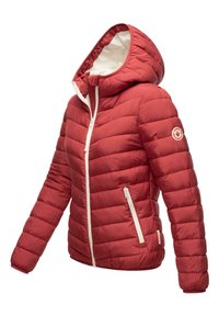 Red puffer jacket with a hood, featuring horizontal stitching, white zipper, and side pockets. Soft, quilted texture with logo on sleeve.