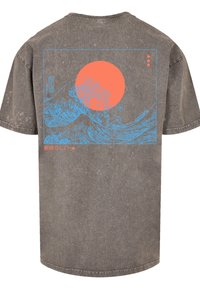 Gray cotton t-shirt featuring blue wave graphic and large orange sun on back, with Japanese text in red, short sleeves, and relaxed fit.
