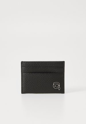 Black leather card holder with a textured surface, featuring multiple card slots and a silver accent logo on the front.