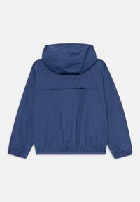 Veste à capuche bleu marine avec des manches longues, des poignets élastiques et un ourlet élastique, présentée de dos sur un fond blanc.
