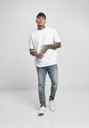 Slim fit jeans - mid heavy destroyed washed
