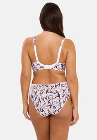 Ensemble de bikini à imprimé floral comprenant une bande blanche et des bretelles ajustables. Le bas a un design taille haute avec des coutures froncées.