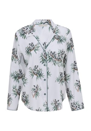 Haut de pyjama blanc à manches longues avec boutons, bordé de vert, arborant un motif répétitif de koalas assis sur des branches d'eucalyptus.