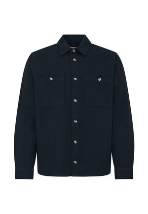 Tumši zila pogājama krekla maiga auduma, ar divām krūšu kabatām, klasisku apkakli un sudrabota toņa pogām.