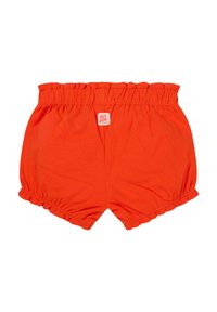 Pomarańczowe bawełniane szorty z elastycznym pasem, z falbanami przy nogawkach i metką "MUY BIEN" z tyłu.