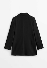 Blazer noir à manches longues avec une coupe droite, détails de coutures visibles au dos et un col classique, présenté de dos sur un fond blanc.