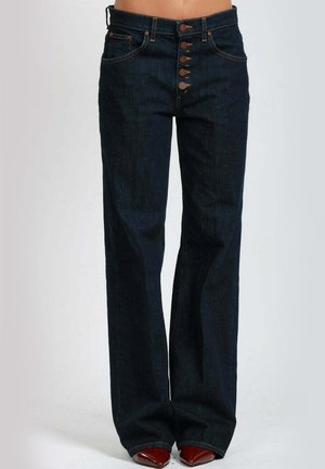 Jeans in denim blu scuro con taglio a gamba larga. Presentano una vita alta, chiusura frontale con cinque bottoni e delicati dettagli di cucitura.