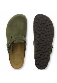 Olive green suede slip-on sandals with adjustable buckle. Cork insole and textured black rubber outsole featuring a wavy pattern.