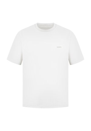 T-shirt en coton blanc à manches courtes, col rond, avec un petit patch logo sur la poitrine gauche. Texture lisse, coupe régulière.