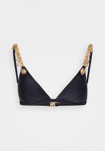 Juodas trikampis liemenėlė, pagaminta iš lygaus audinio. Papuošta auksinėmis grandinėlėmis ant dirželių ir auksiniu užsegimu priekyje.