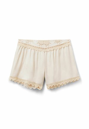 Pantalones cortos para mujer de color crema con borde de encaje en ondas en la cintura y aberturas de las piernas, con patrones bordados florales y geométricos.