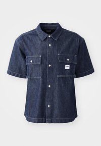 Dark blue denim short-sleeve shirt with a button-up front, featuring two chest pockets and a small logo patch near the left pocket.