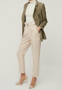 Trendyol Kalhoty - beige