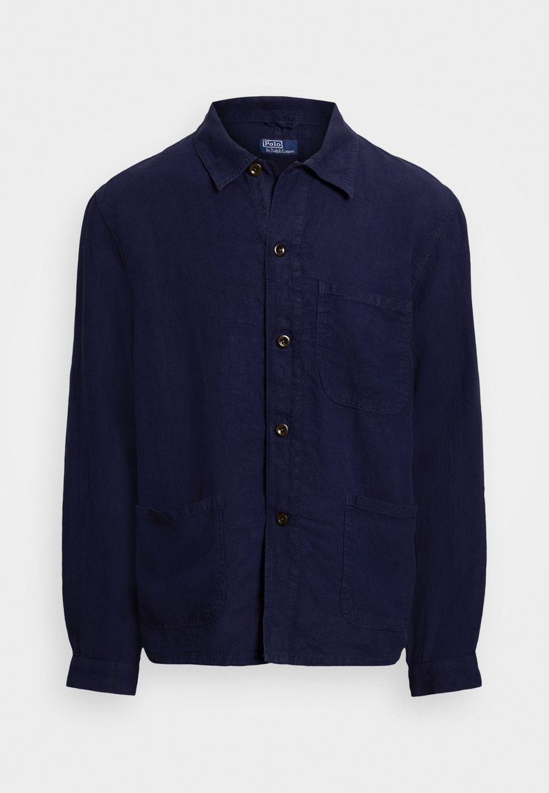 Navy blue linen shirt with a button-up front, a collar, two front pockets, and long sleeves. Accented with brown buttons.