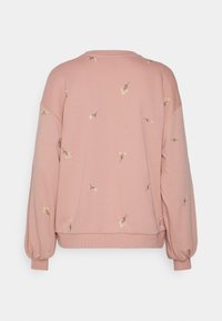 Felpa rosa a maniche lunghe con piccoli ricami floreali bianchi sparsi sulla schiena e sulle maniche, con polsini e orlo a costine.