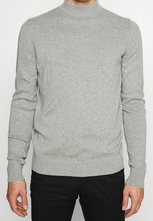 Grauer Rollkragenpullover aus weichem Strickstoff, mit langen Ärmeln und einer figurbetonten Silhouette, versehen mit gerippten Bündchen und Saum.