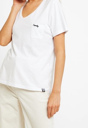 White cotton T-shirt with a V-neck, short sleeves, and a left chest pocket. Features embroidered logo and a side brand label.