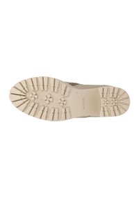 Sole in gomma beige chiaro con scanalature profonde per una buona aderenza. Presenta bordi arrotondati e testo del marchio inciso, taglia 38, vicino all'area dell'arco.