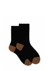 Calze nere con una texture morbida e un accento marrone nella zona delle dita. Il design presenta un risvolto a coste per una vestibilità sicura. Lunghezza standard.