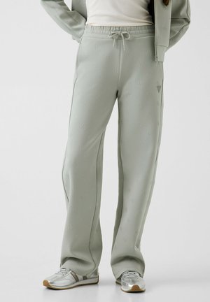 Guess, CALISTA 4G WIDE LEG PANTS - Pantaloni sportivi - fsr g allover impres