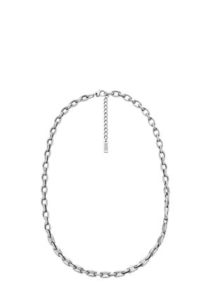 Silver chain necklace featuring large, oval links and a shorter extension chain with a branded tag for adjustability.