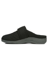 Black quilted slipper with a cloth upper and a sturdy grey rubber sole. Features a wide adjustable strap for a secure fit.