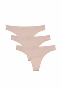 Trois paires de strings en coton beige avec un design sans coutures, présentant une texture lisse et sans matériel ou motifs visibles.