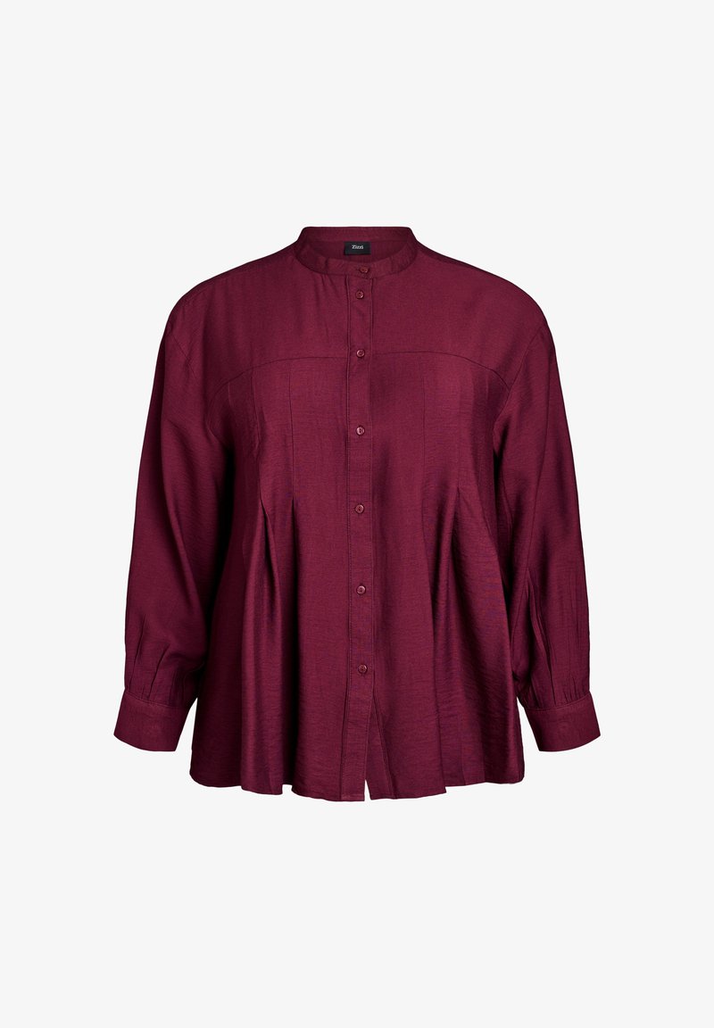 Camicia bordeaux con bottoni, maniche lunghe, design con pieghe frontali, texture morbida e colletto a fascia. Presenta una chiusura con bottoni e spacchi laterali.
