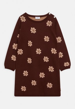 Brun langærmet kjole med beige blomsterprint og to hvide knapper på venstre skulder, rund halsudskæring.